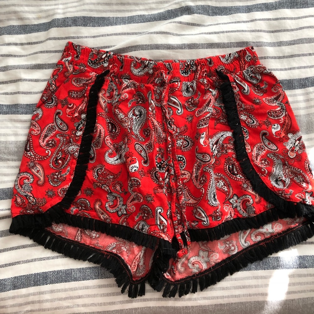 Justify red and black fringe shorts